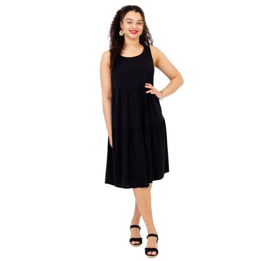 female model wearing black juni dress front veiw on white background