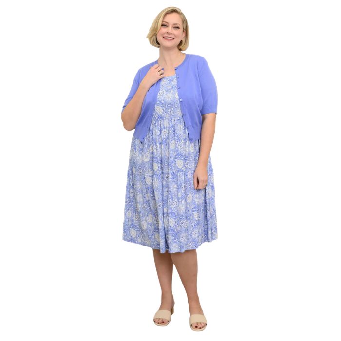 female model wearing peri teatime print  juni dress and blue isabella cardigan front veiw on white background