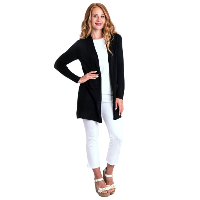 female model wearing justine black draped cardigan sweater reanne white tank top and nadine white croppped pants front view on white background