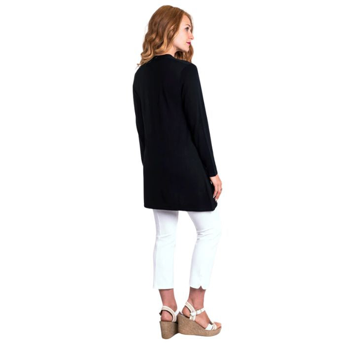 female model wearing black justine draped cardigan sweater, white reanna tank top and white nadine croppped pants back view on white background
