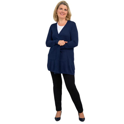 female model wearing justine indigo blue draped cardigan sweater, jazz white tank top and nadia black pants front view on white background