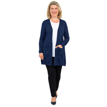 female model wearing justine indigo blue draped cardigan sweater, jazz white tank top and nadia black pants front view on white background