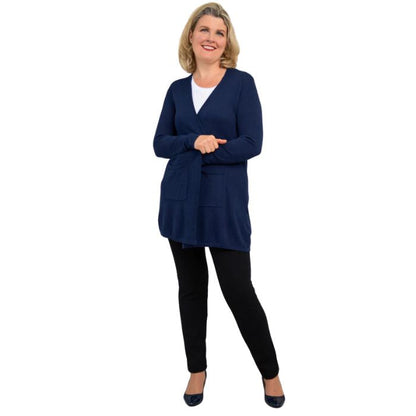 female model wearing indigo blue justine draped cardigan sweater, white jazz tank top and nlack nadia pants front view on white background