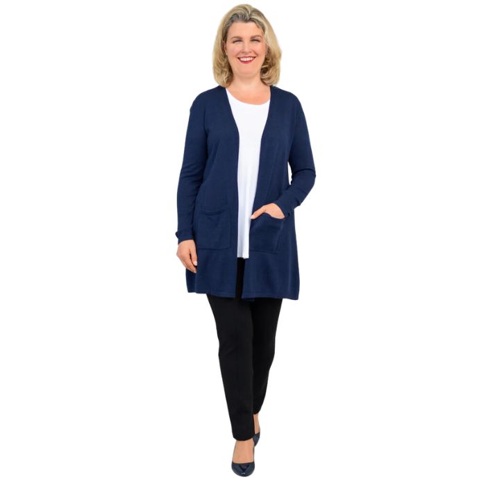 female model wearing indigo blue justine draped cardigan sweater, white jazz tank top and nlack nadia pants front view on white background