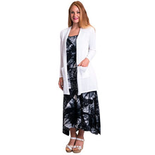 female model wearing justine white draped cardigan sweater over long dress side view on white background