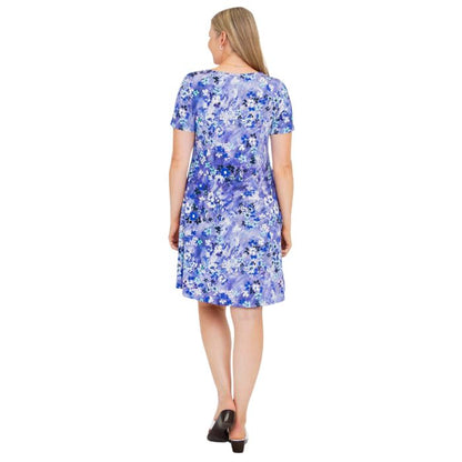 woman wearing creative print lanai dress back view set on a white background