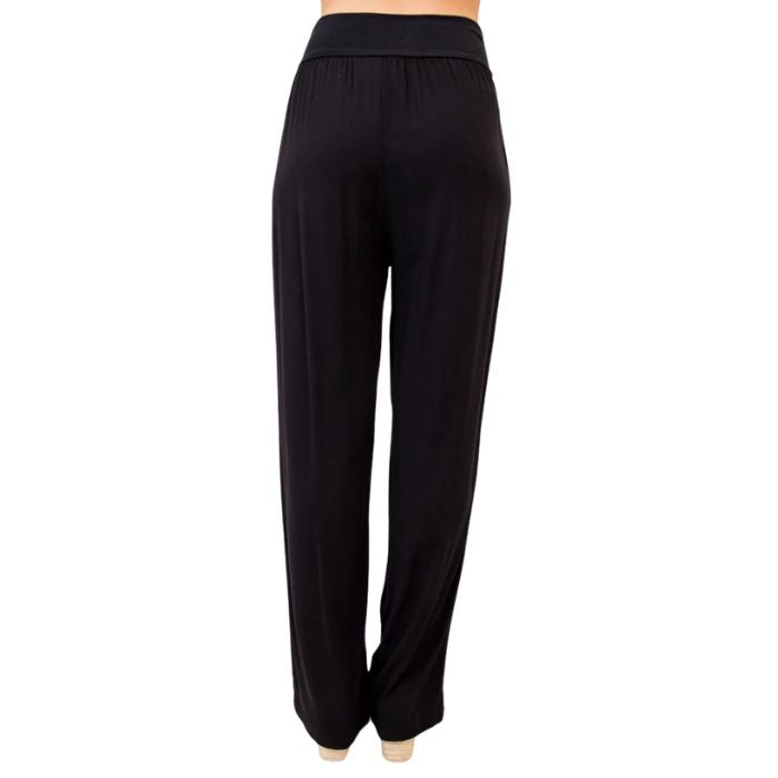 female model wearing black landon pants back view on white background