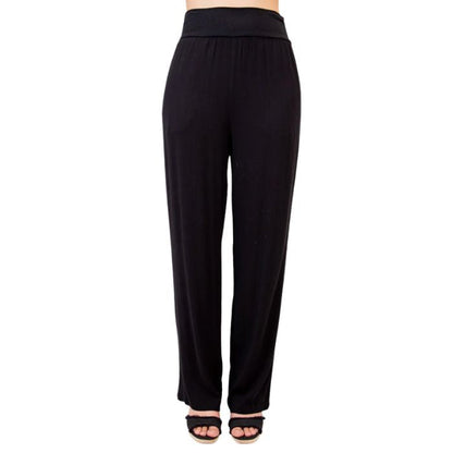 female model wearing black landon pants front view on white background