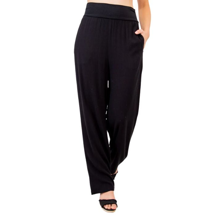female model wearing black landon pants front view on white background