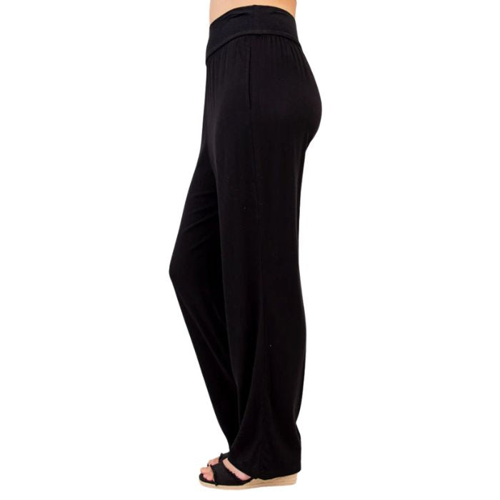 female model wearing black landon pants side view on white background