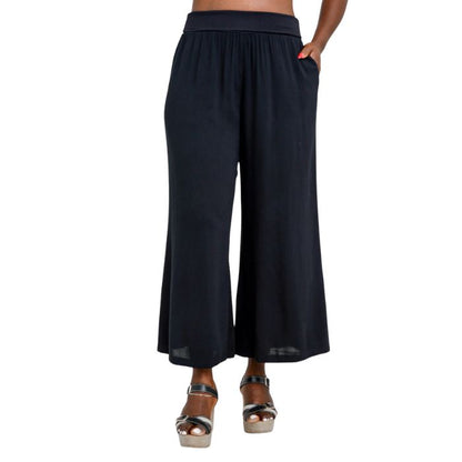 female model wearing black landon capri pants front view on white background