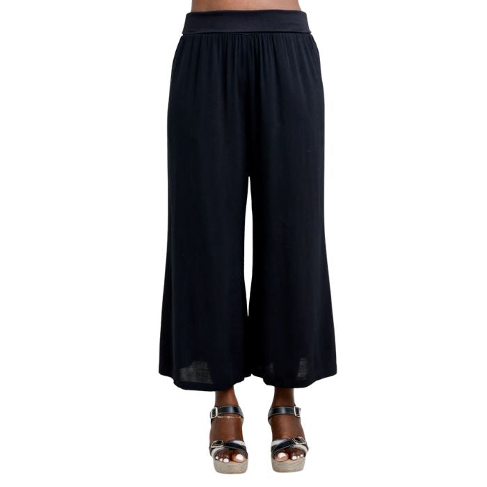 female model wearing black landon capri pants front view on white background
