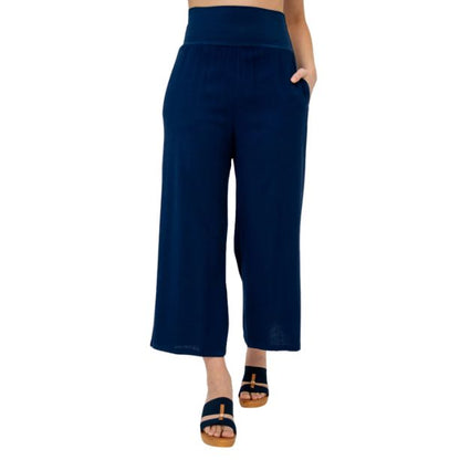 female model wearing indigo blue landon capri pants front view on white background