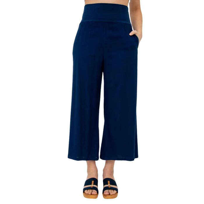 female model wearing indigo blue landon capri pants front view on white background