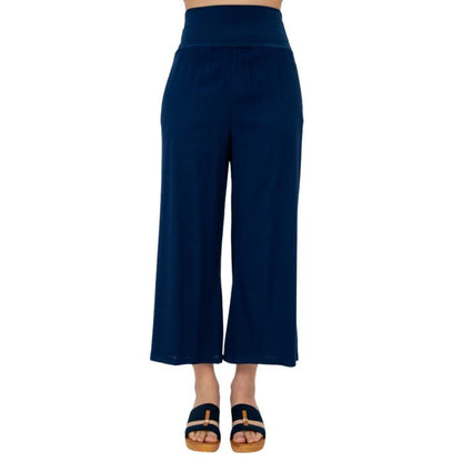 female model wearing indigo blue landon capri pants front view on white background