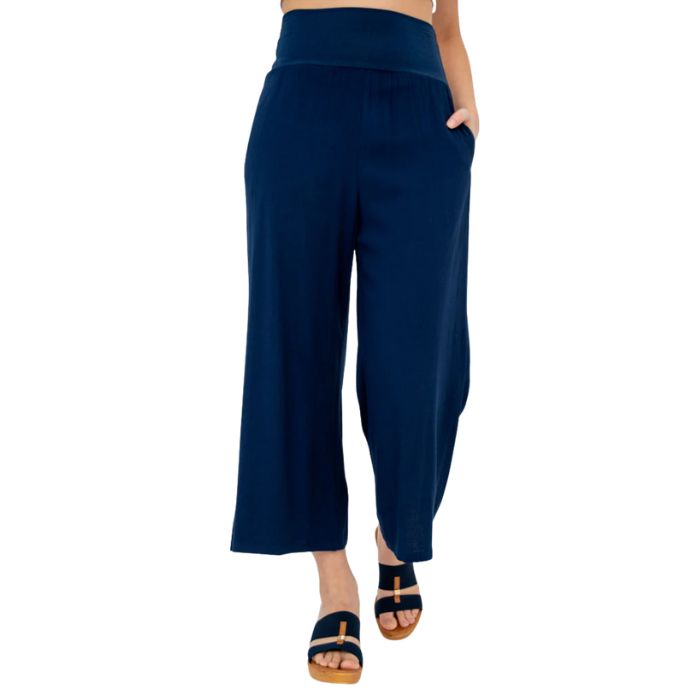 female model wearing indigo blue landon capri pants front view on white background