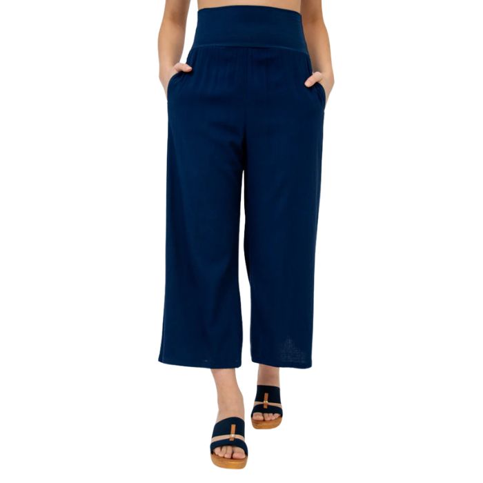 female model wearing indigo blue landon capri pants front view on white background