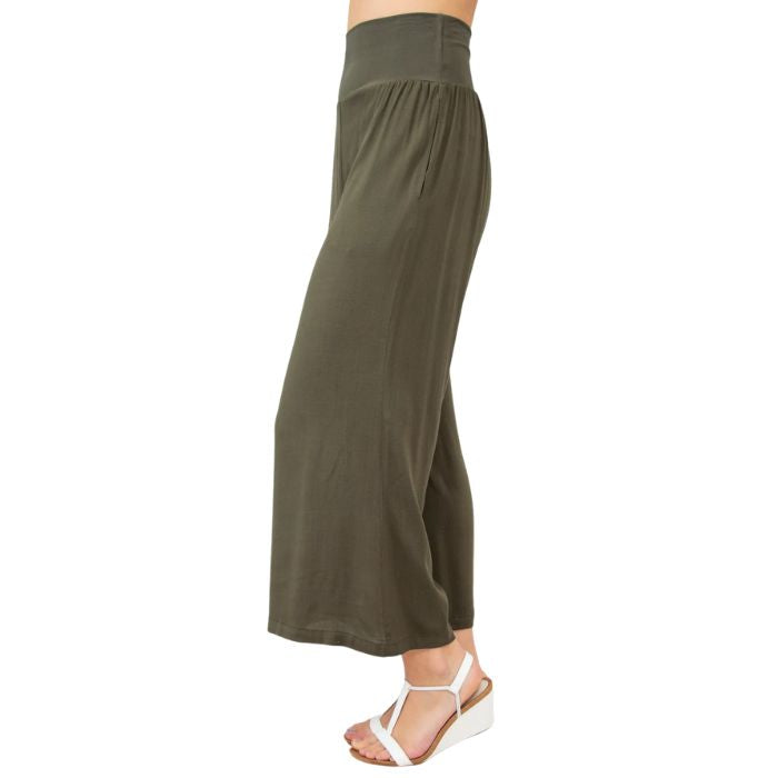 female model wearing khaki green landon capri pants side view on white background