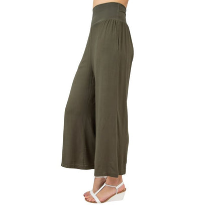 female model wearing khaki green landon capri pants side view on white background