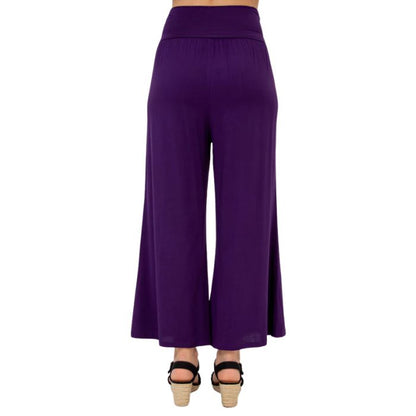 female model wearing royale purple landon capri pants back view on white background