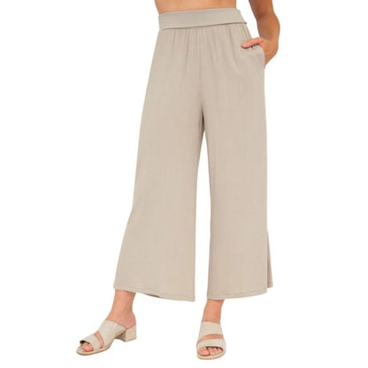 female model wearing sand brown landon capri pants front view on white background