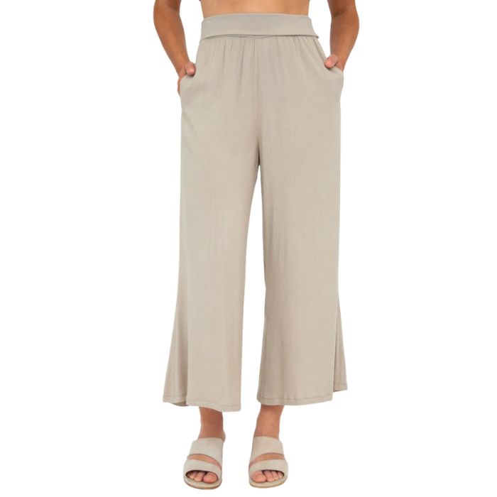 female model wearing sand brown landon capri pants front view on white background