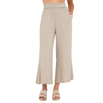 female model wearing sand brown landon capri pants front view on white background