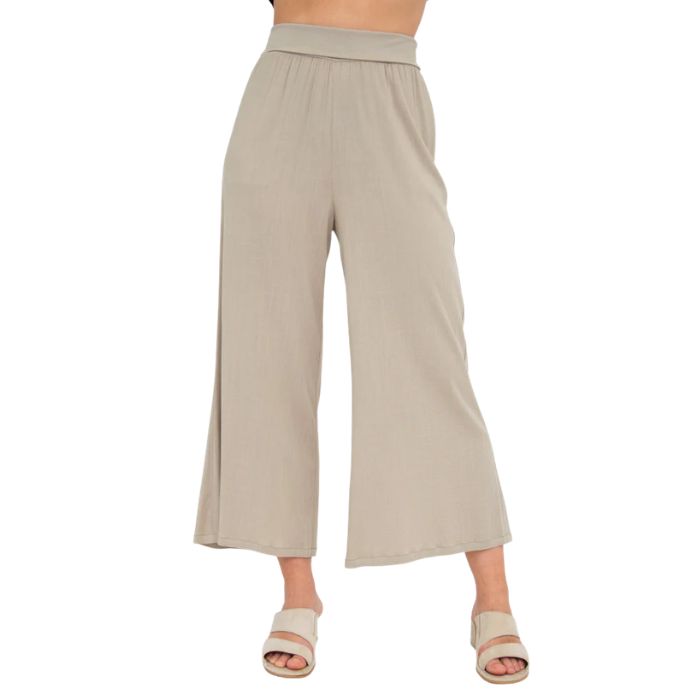 female model wearing sand brown landon capri pants front view on white background