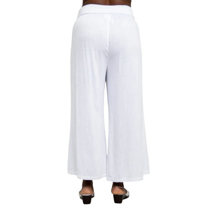 female model wearing white landon capri pants back view on white background