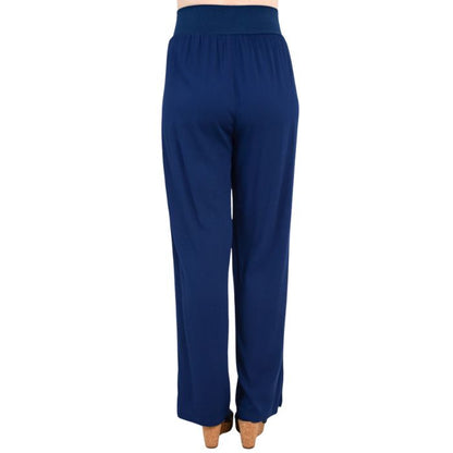 female model wearing indigo blue landon pants back view on white background