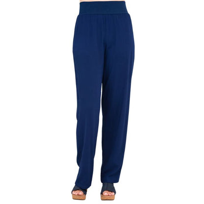 female model wearing indigo blue landon pants front view on white background