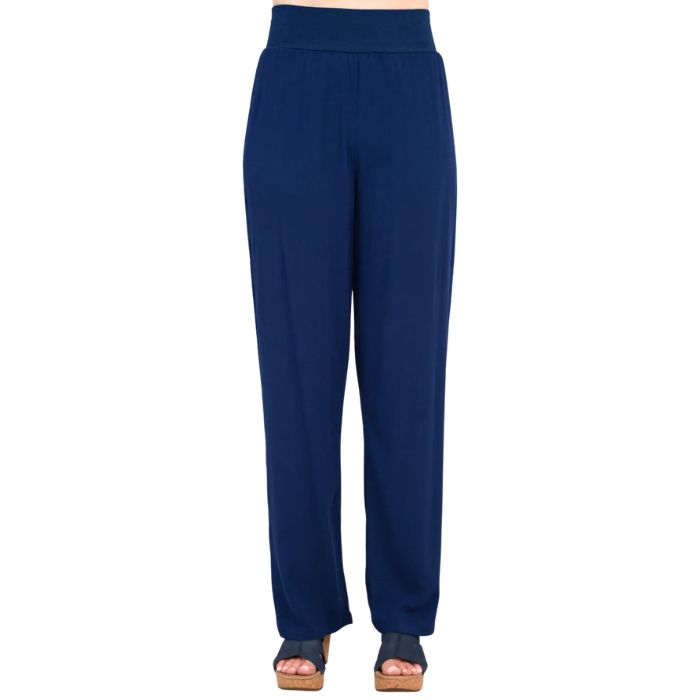 female model wearing indigo blue landon pants front view on white background
