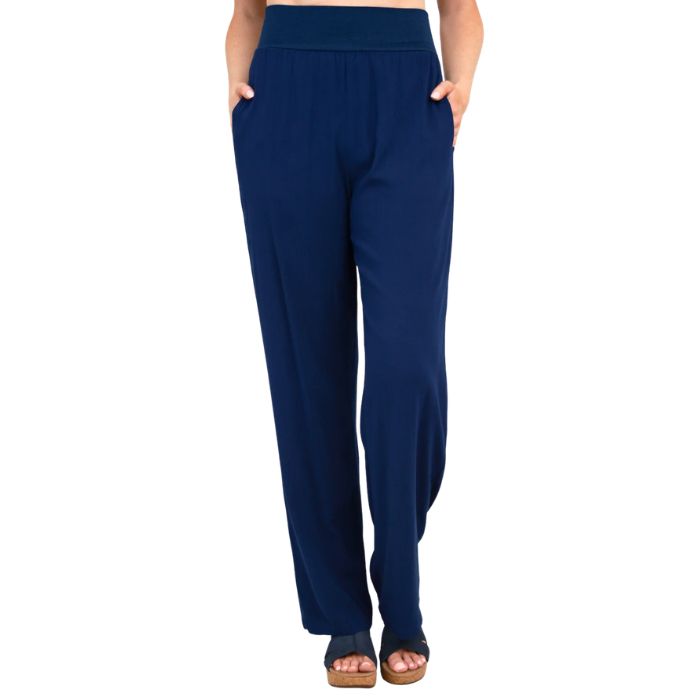 female model wearing indigo blue landon pants front view on white background