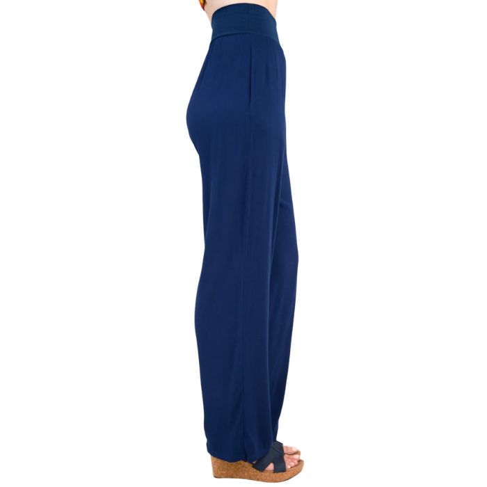 female model wearing indigo blue landon pants side view on white background