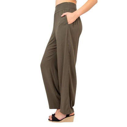 female model wearing khaki green landon pants side view on white background