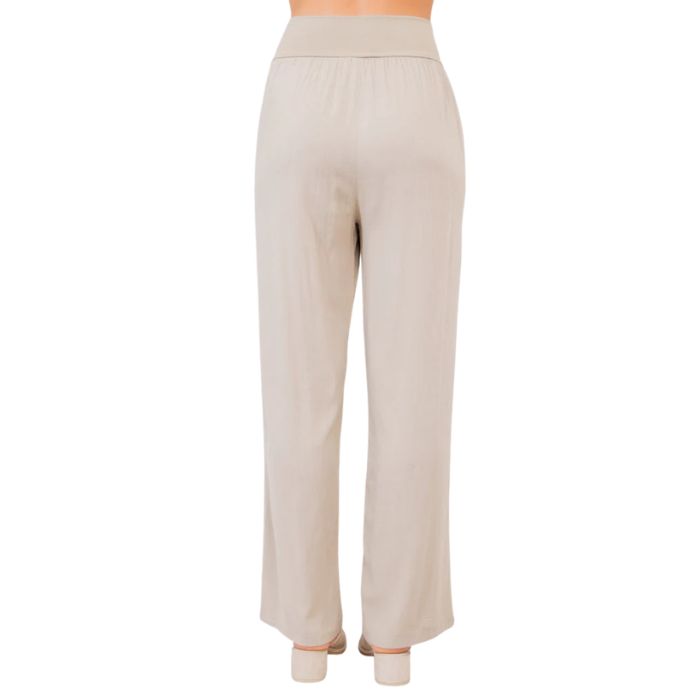 female model wearing sand brown landon pants back view on white background
