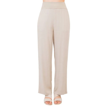 female model wearing sand brown landon pants front view on white background