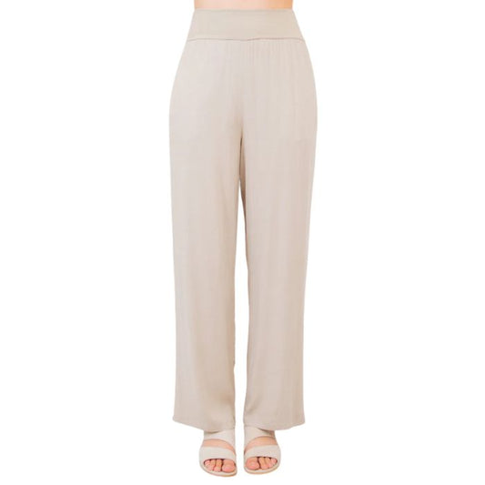 female model wearing sand brown landon pants front view on white background