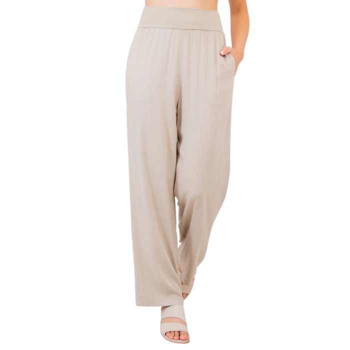 female model wearing sand brown landon pants front view on white background