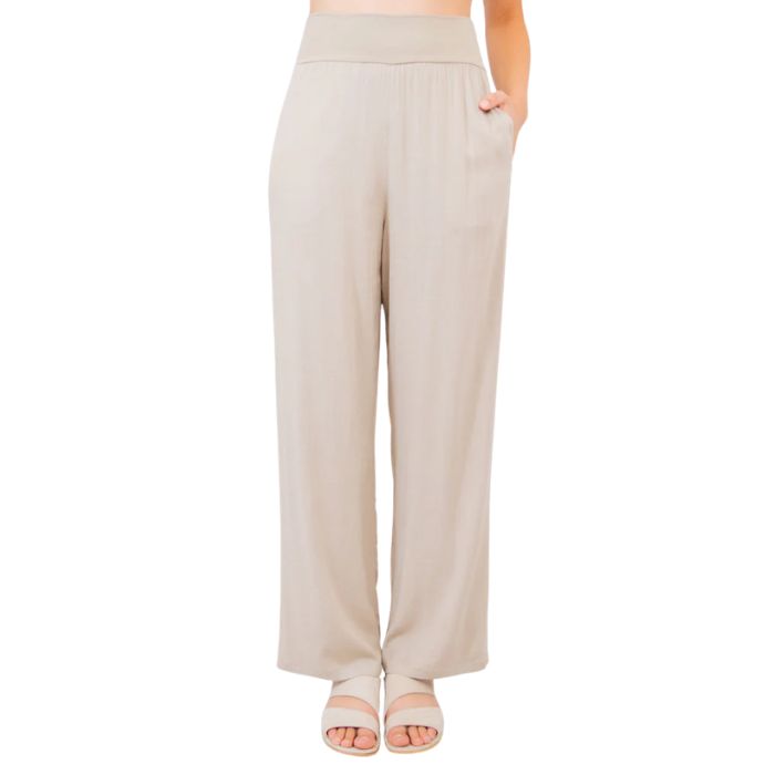 female model wearing sand brown landon pants front view on white background