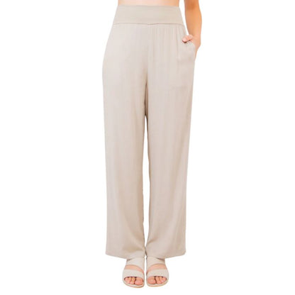 female model wearing sand brown landon pants front view on white background