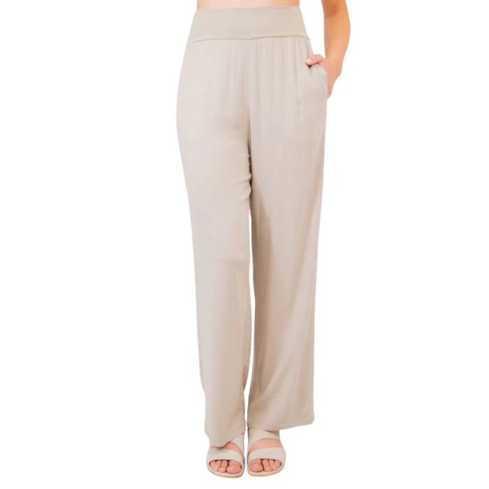 female model wearing sand brown landon pants front view on white background