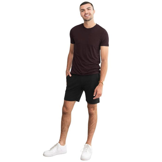 man wearing dark chocolate brown lawrence crew neck t-shirt and black aspen shorts front view on white background