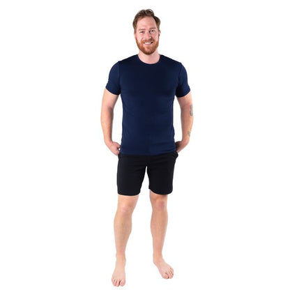 male model wearing ink blue lawrence crew neck t-shirt and black aspen shorts front view on white background