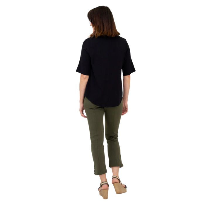 female model wearing black liza top and khaki green nadine cropped pants back view on white background