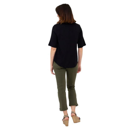 female model wearing black liza top and khaki green nadine cropped pants back view on white background