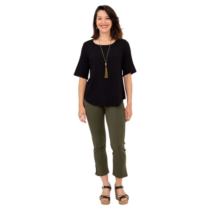 female model wearing black liza top and khaki green nadine cropped pants front view on white background