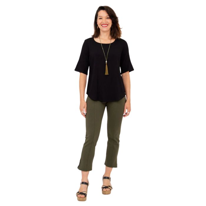 female model wearing black liza top and khaki green nadine cropped pants front view on white background