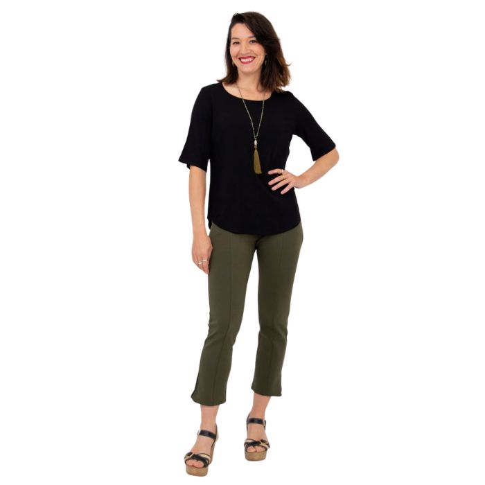 female model wearing black liza top and khaki green nadine cropped pants front view on white background