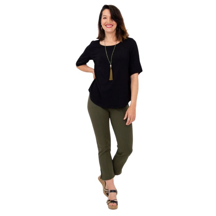 female model wearing black liza top and khaki green nadine cropped pants front view on white background